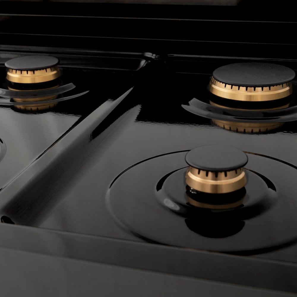 ZLINE Autograph Edition 30 in. 4.0 cu. ft. Legacy Dual Fuel Range with 4 Burner Gas Cooktop and Electric Convection Oven in Black Stainless Steel and Polished Gold Accents (RABZ-30-G) close-up, brass burners on black porcelain cooktop with no grates.