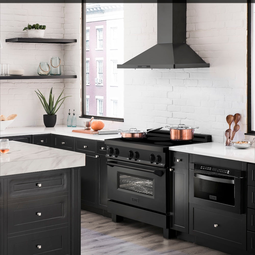 ZLINE 36 in. 4.6 cu. ft. Induction Range with a 5 Element Stove and Electric Oven in Black Stainless Steel (RAIND-BS-36) from side in a luxury farmhouse-style kitchen.
