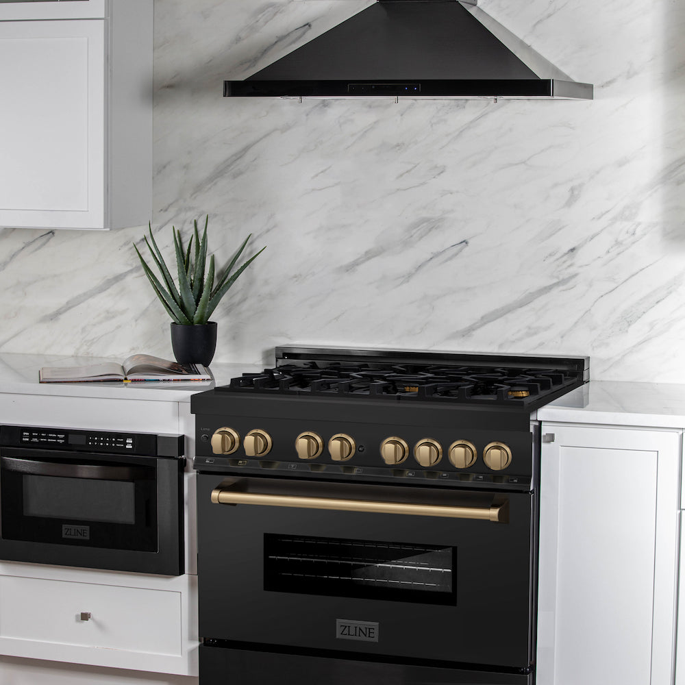 ZLINE Autograph Edition 36 in. 4.6 cu. ft. Dual Fuel Range with Gas Stove and Electric Oven in Black Stainless Steel with Champagne Bronze Accents (RABZ-36-CB) in a luxury cottage-style kitchen with matching range hood and microwave.