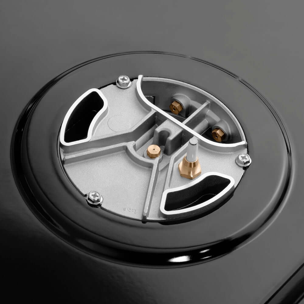 ZLINE Autograph Edition 30 in. 4.2 cu. ft. Paramount Gas Range with 4 Burner DuoPro™ Cooktop and Convection Gas Oven in Black Satin Stainless Steel and Champagne Bronze Accents (PSGRBSZ-30-CB) under DuoPro™ brass burner close-up showing dual-port design.