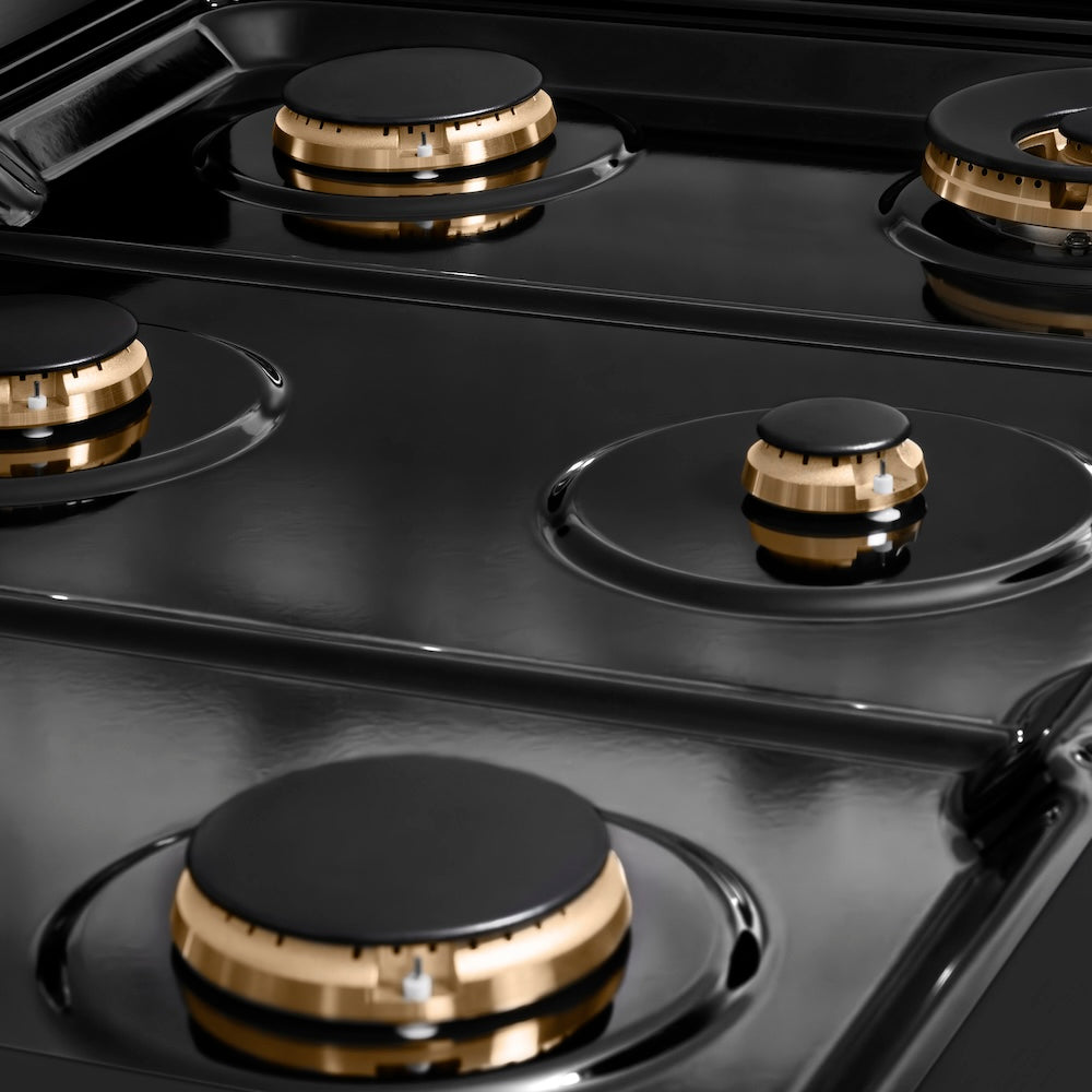 ZLINE Autograph Edition 36 in. 5.2 cu. ft. Paramount Gas Range with 6 Burner Cooktop and Convection Gas Oven in Black Stainless Steel with Polished Gold Helix Handle and Knob Accents (SGRBZ-36-KG) black porcelain cooktop and brass burners with no grates.
