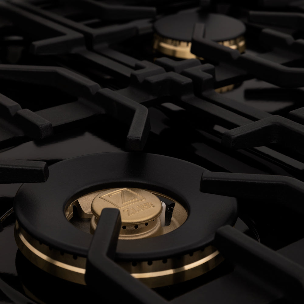 ZLINE brass burners on black porcelain cooktop.