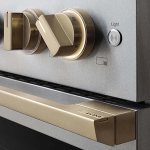 ZLINE Autograph Edition 36 in. 5.2 cu. ft. Marino Gas Range with 6 Burner Cooktop and Convection Gas Oven in Satin Stainless Steel and Champagne Bronze Accents (MGRSZ-36-CB) close-up, oven and cooktop knobs.