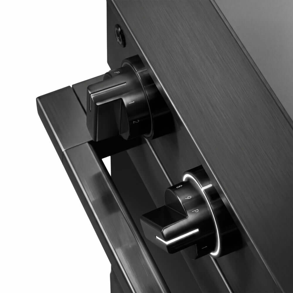 ZLINE 36 in. 5.2 cu. ft. Marino Induction Range with 5 Element Cooktop and Electric Convection Oven in Black Stainless Steel (MINRB-36) close-up, modern oven and cooktop knobs.