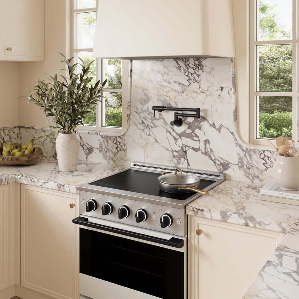ZLINE Autograph Edition 30 in. 4.2 cu. ft. Marino Induction Range with 4 Element Cooktop and Electric Convection Oven in Stainless Steel with White Matte Door and Matte Black Accents (MINRZ-WM-30-MB) in a designer kitchen with custom details.