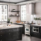 ZLINE Convertible Vent Wall Mount Range Hood in Stainless Steel with Crown Molding (KECRN) in a dark rustic-style kitchen.