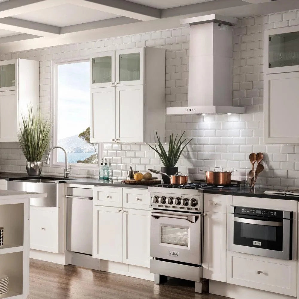 ZLINE Convertible Vent Wall Mount Range Hood in Stainless Steel with Crown Molding (KECRN) in a white cottage-style kitchen.