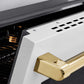 ZLINE Autograph Edition 36 in. 5.2 cu. ft. Paramount Induction Range with 5 Element Cooktop and Electric Convection Oven in Satin Stainless Steel with White Matte Door and Polished Gold Accents (SINRSZ-WM-36-G) oven door slightly open showing handle detail.