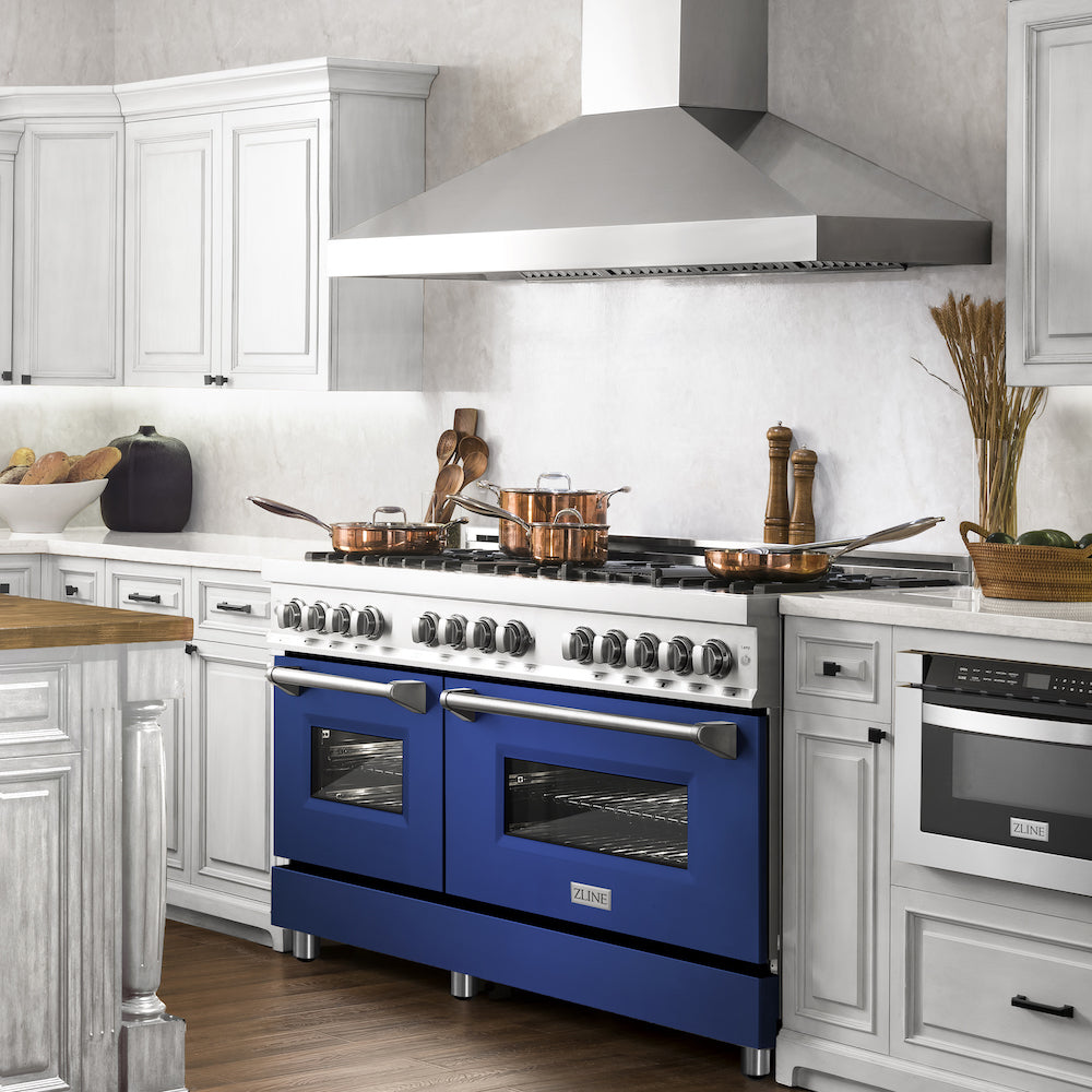 ZLINE 60 in. 7.4 cu. ft. Dual Fuel Range with Gas Stove and Electric Oven in Stainless Steel with Blue Matte Doors (RA-BM-60) from side in a luxury farmhouse-style kitchen.