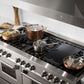 ZLINE 60 in. 7.4 cu. ft. Legacy Dual Fuel Range with Gas Cooktop and 2 Electric Convection Ovens in Stainless Steel with 8 Brass Burners (RA-BR-60) in a luxury kitchen.