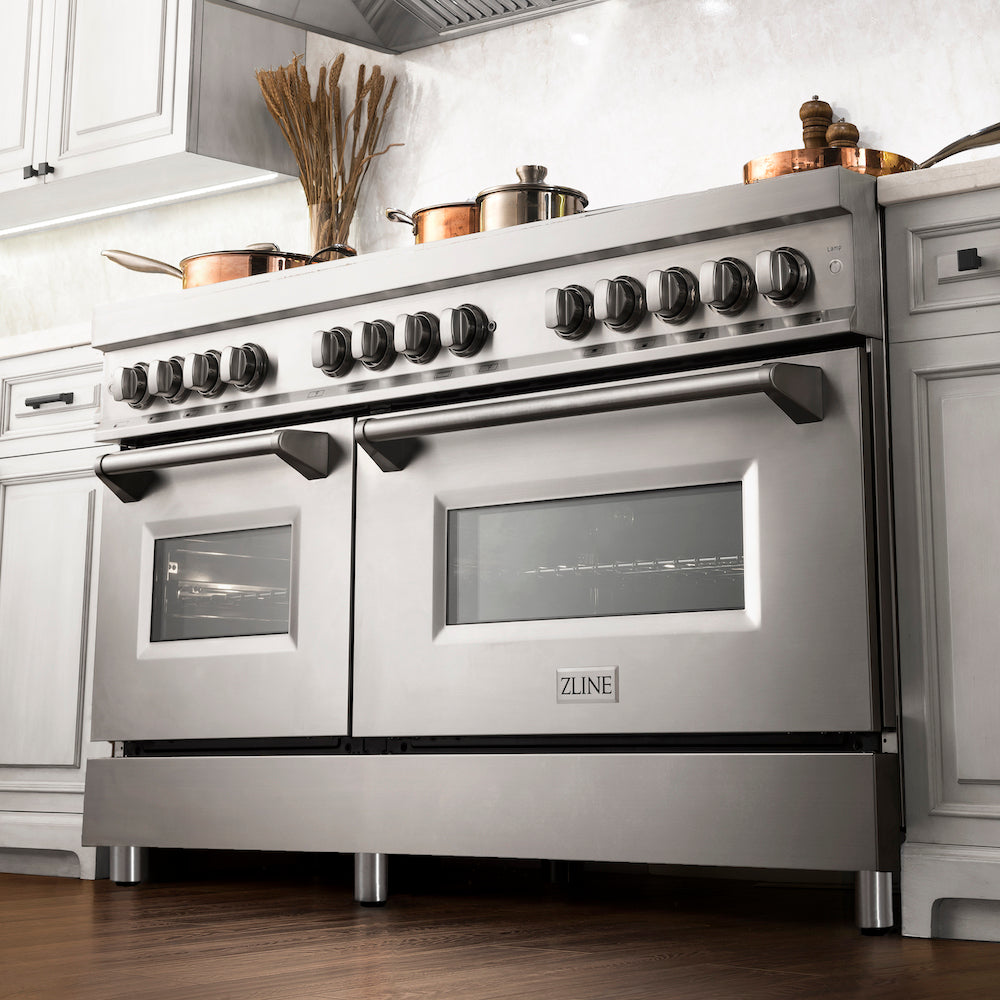 ZLINE 60 in. 7.4 cu. ft. Dual Fuel Range with Gas Stove and Electric Oven in Stainless Steel with Brass Burners (RA-BR-60) from below in a luxury kitchen with cookware on cooktop.