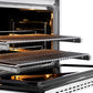 ZLINE Autograph Edition 36 in. 5.2 cu. ft. Paramount Dual Fuel Range with 6 Burner DuoPro™ Cooktop and Electric Convection Oven with White Matte Door and Polished Gold Accents (PSDRZ-WM-36-G) side, oven open showing racks extended.