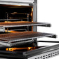 ZLINE Autograph Edition 36 in. 5.2 cu. ft. Paramount Dual Fuel Range with 6 Burner Gas Cooktop and Electric Convection Oven in Stainless Steel with Champagne Bronze Helix Handle and Knob Accents (SDRZ-36-KCB) side, open, close-up, racks extended showing interior details.