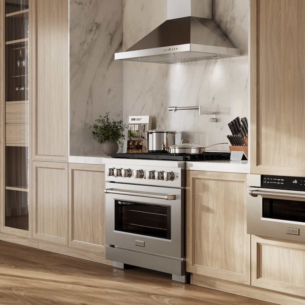 ZLINE 36 in. 5.2 cu. ft. Paramount Dual Fuel Range with 6 Burner Gas Cooktop and Electric Convection Oven in Stainless Steel (SDR36) in a luxury kitchen.