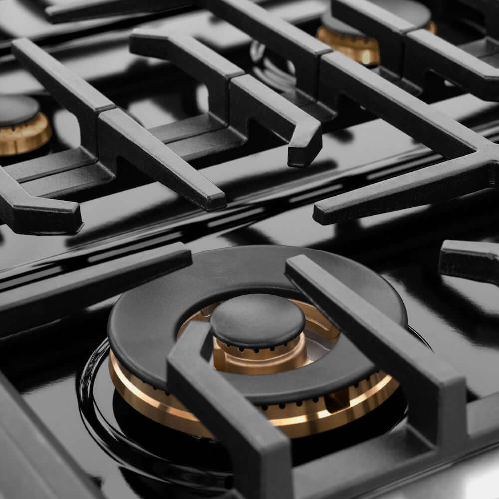 ZLINE 36" Gas Range with Brass Burners close up black porcelain cooktop and cast-iron grates.
