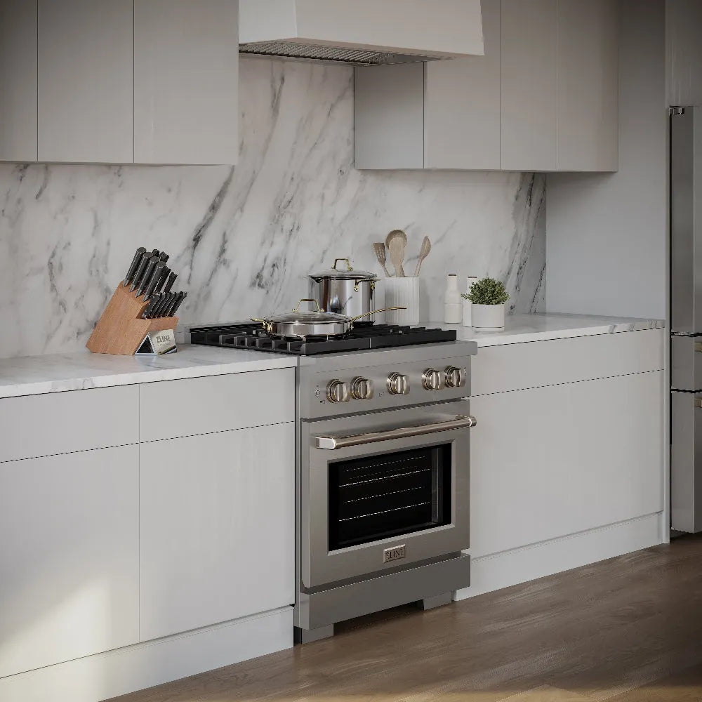 Modern kitchen with a stainless steel range and marble countertop