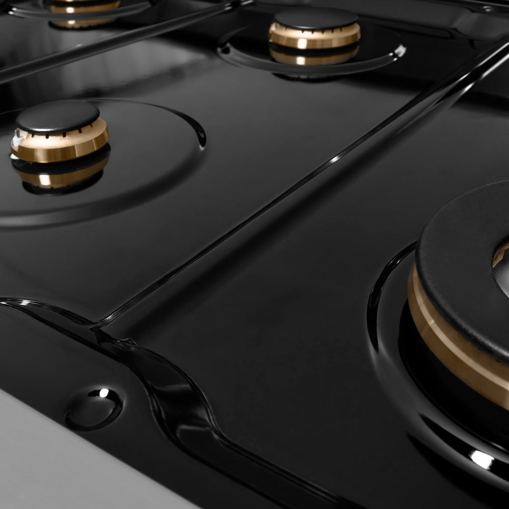 ZLINE Autograph Edition 48 in. 6.7 cu. ft. Paramount Double Oven Gas Range with 8 Burner Cooktop in Stainless Steel and Polished Gold Helix Handles and Knob Accents (SGRZ-48-KG) black porcelain cooktop and brass burners with no grates.