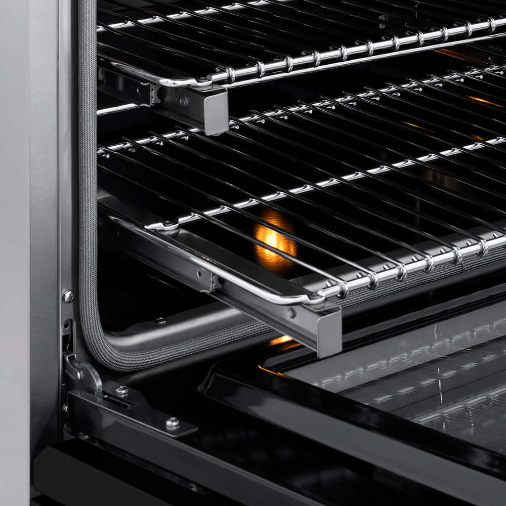 ZLINE 36 in. 5.2 cu. ft. Paramount Induction Range with 5 Element Cooktop and Electric Convection Oven in Stainless Steel with Black Matte Door (SINR-BLM-36) close-up, open oven with racks extended, showing interior components.