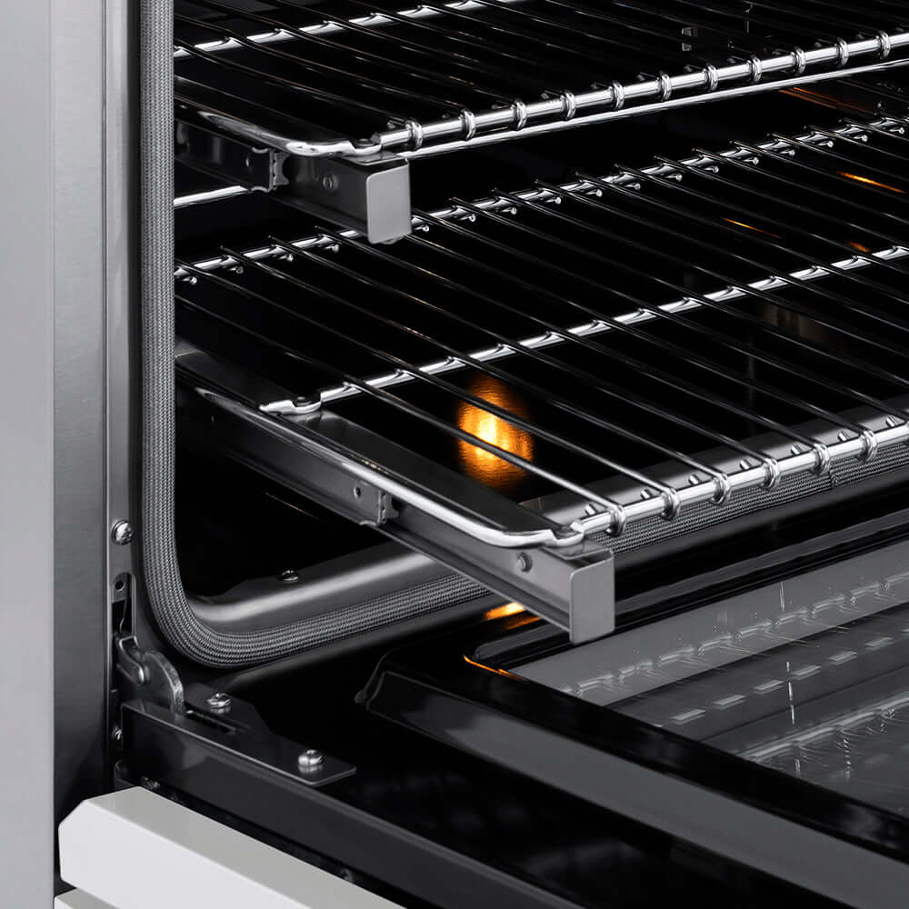 ZLINE 36 in. 5.2 cu. ft. Paramount Induction Range with 5 Element Cooktop and Electric Convection Oven in Stainless Steel with White Matte Door (SINR-WM-36) close-up, open oven with racks extended, showing interior components.