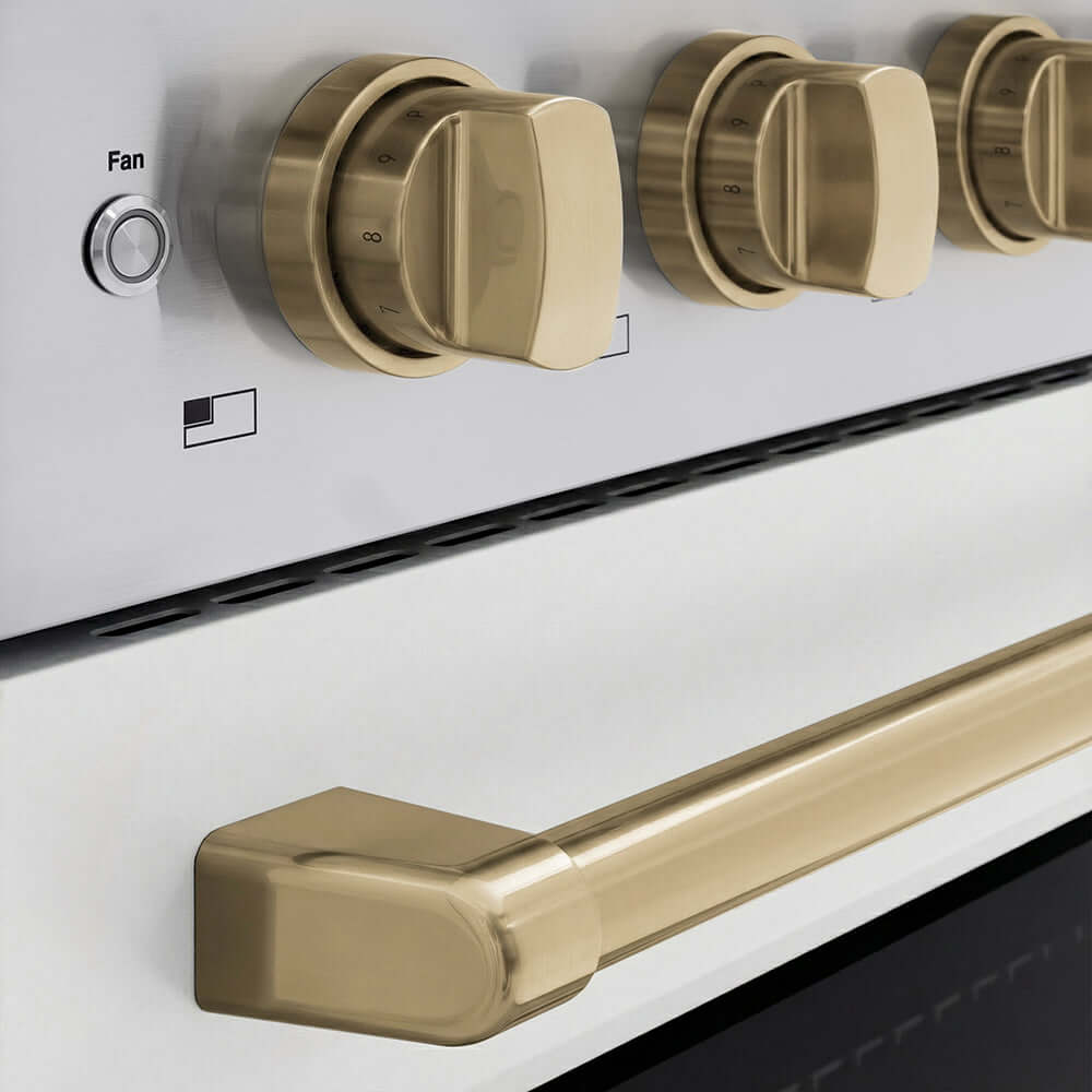 ZLINE Autograph Edition 36 in. 5.2 cu. ft. Paramount Induction Range with 5 Element Cooktop and Electric Convection Oven in Stainless Steel with White Matte Door and Champagne Bronze Accents (SINRZ-WM-36-CB) close-up of oven and cooktop knob controls.