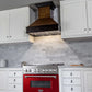 ZLINE 36 in. 4.6 cu. ft. Legacy Dual Fuel Range with 6 Burner Gas Cooktop and Electric Convection Oven in Stainless Steel and Red Gloss Door (RA-RG-36) in a luxury kitchen.