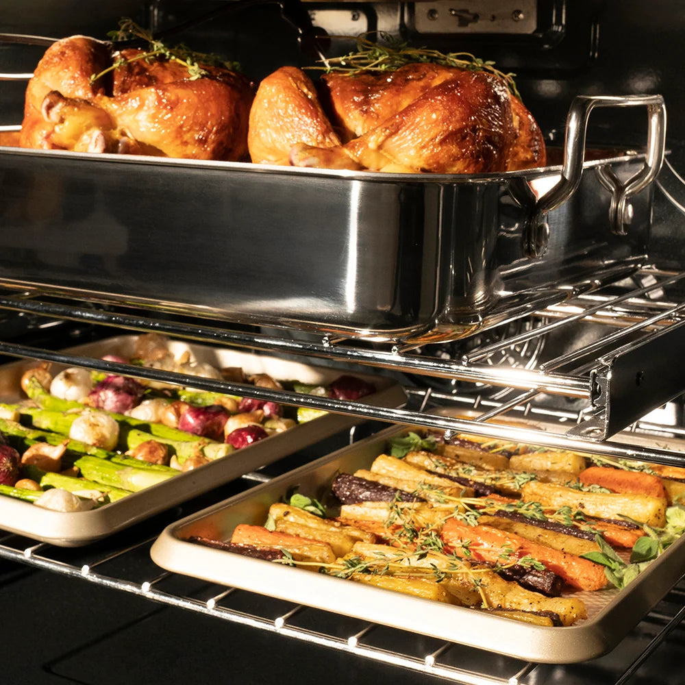 Roasted chicken and vegetables in a ZLINE 30 in. Professional True Convection Double Wall Oven with Air Fry and Self Clean in Stainless Steel (WAD-30) with a metal pan.