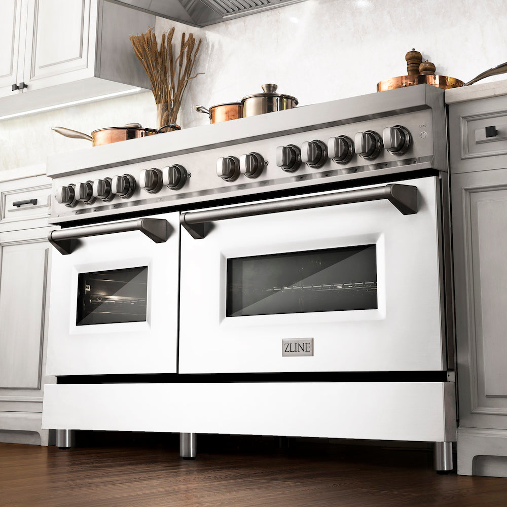 ZLINE 60 in. 7.4 cu. ft. Legacy Dual Fuel Range with 9 Burner Gas Cooktop and 2 Electric Convection Ovens in Stainless Steel and White Matte Doors (RA-WM-60) in a luxury kitchen.