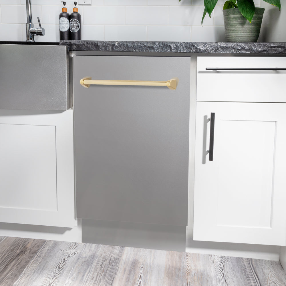 ZLINE Autograph Edition 18 in. Tallac Series 3rd Rack Dishwasher with Auto Door Open Drying, 51dBa, Stainless Steel Panel with Polished Gold Handle (DWVZ-304-18-G) in a modern kitchen with white cabinets and a gray countertop.