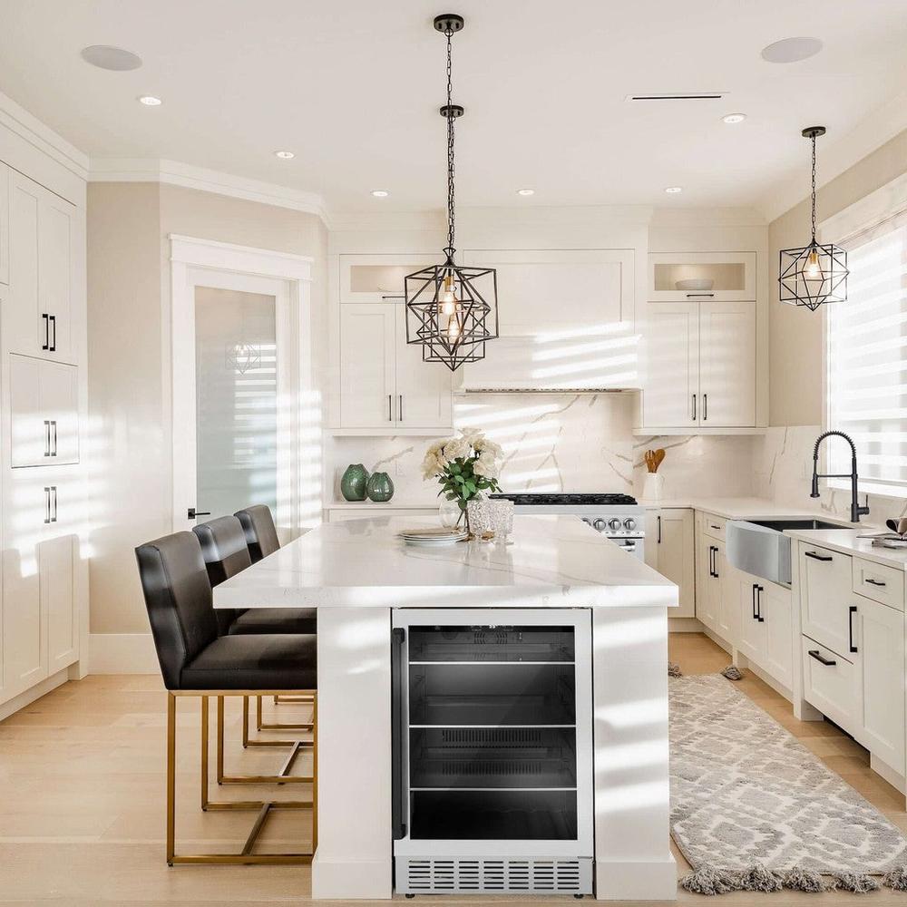 ZLINE Autograph Edition 24 in. Monument 154 Can Beverage Fridge in Stainless Steel with Matte Black Accents (RBVZ-US-24-MB) built-in to an island in a cottage-style kitchen.