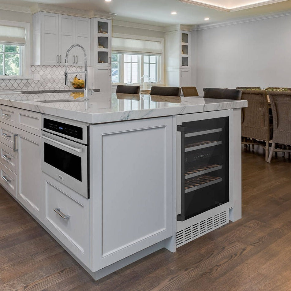 ZLINE Autograph Edition 24 in. Monument 154 Can Beverage Fridge in Stainless Steel with Matte Black Accents (RBVZ-US-24-MB) built-in to farmhouse kitchen island with marble countertop.