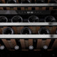 ZLINE Autograph Edition 24 in. Monument Dual Zone 44-Bottle Wine Cooler in Stainless Steel with Matte Black Accents (RWVZ-UD-24-MB) close-up, wine bottles one wooden shelves from below.