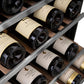 ZLINE Autograph Edition 24 in. Monument Dual Zone 44-Bottle Wine Cooler in Stainless Steel with Matte Black Accents (RWVZ-UD-24-MB) close-up, racks of red and white wine bottles stored on adjustable wood shelves.
