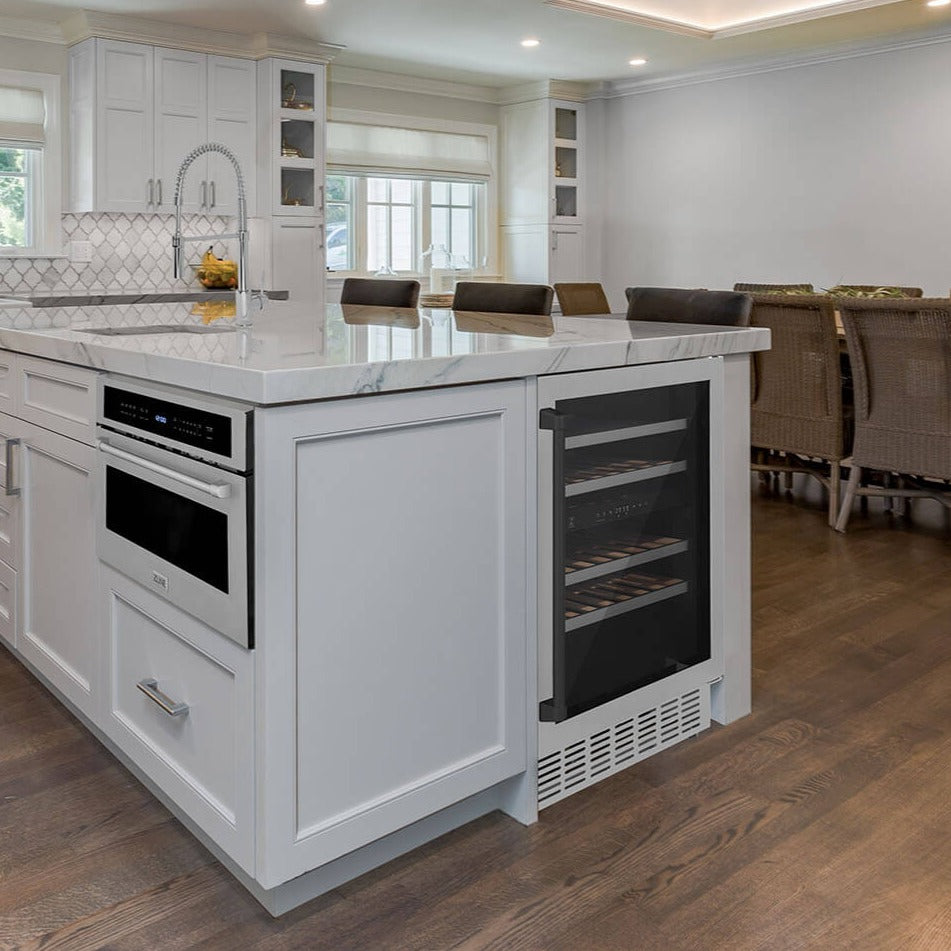 ZLINE Autograph Edition 24 in. Monument Dual Zone 44-Bottle Wine Cooler in Stainless Steel with Matte Black Accents (RWVZ-UD-24-MB) built-in to farmhouse kitchen island with marble countertop.