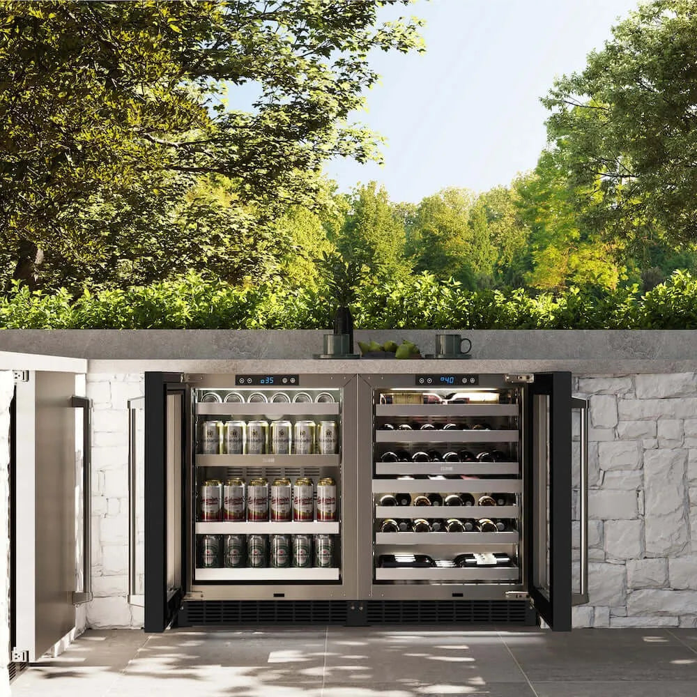 ZLINE 24 in. Touchstone 151 Can Beverage Fridge With Black Matte Glass Door (RBSO-BLM-24) front, open, in an outdoor patio area with a matching wine cooler against a stone wall and greenery.