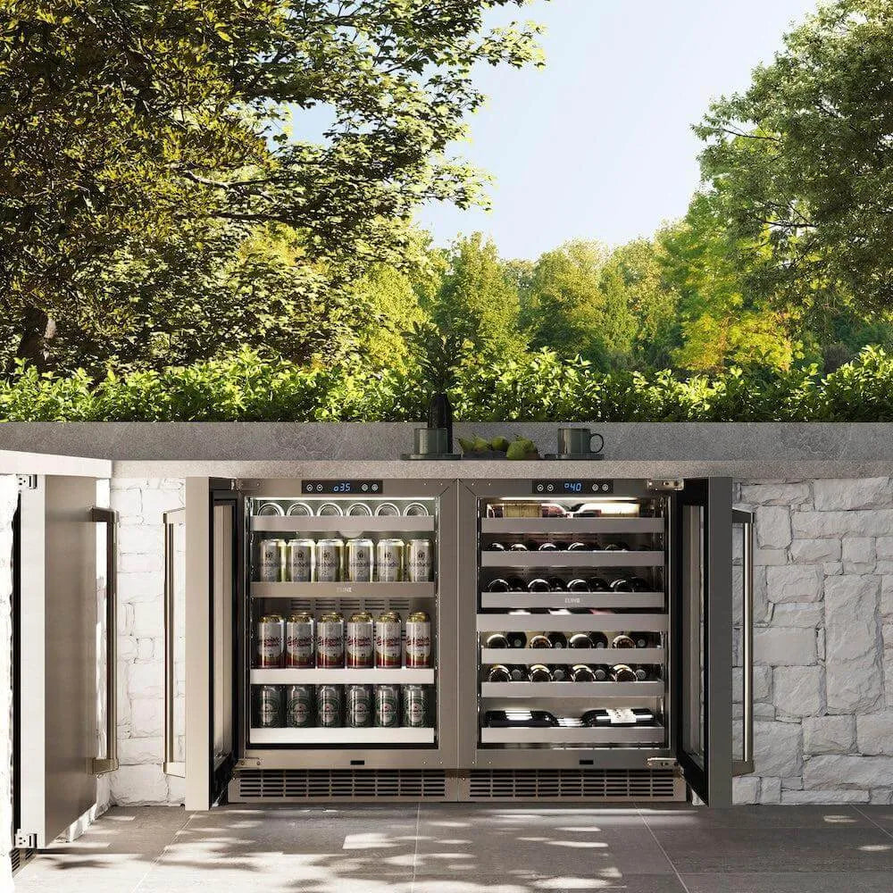 ZLINE 24 in. Touchstone Dual Zone 44 Bottle Wine Cooler With Stainless Steel Glass Door (RWDO-GS-24) front, open, in an outdoor patio area with a matching beverage fridge against a stone wall and greenery.
