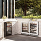 ZLINE 24 in. Touchstone 151 Can Beverage Fridge With White Matte Glass Door (RBSO-WM-24) side, in an outdoor patio area against a stone wall and greenery.