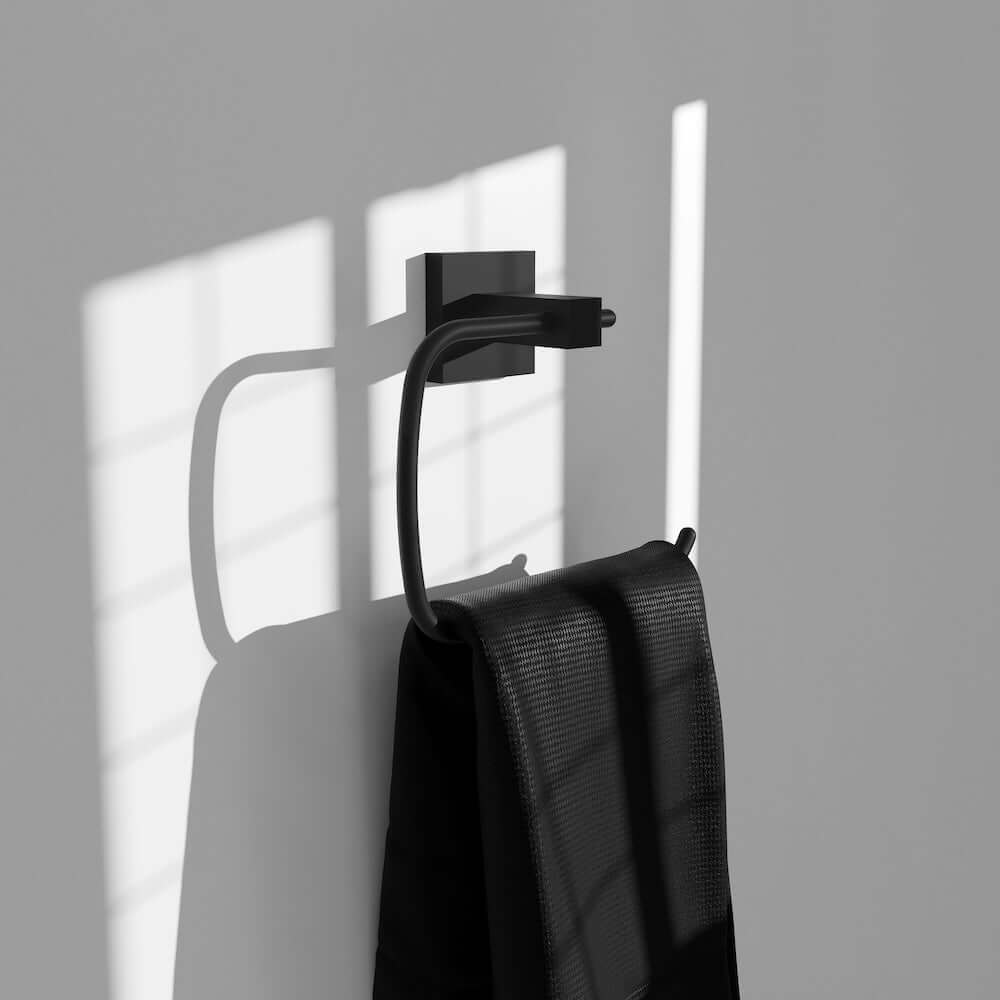 ZLINE Palisades Towel Ring in Matte Black (RBCN1-TRNG-MB) with a black towel on a gray wall