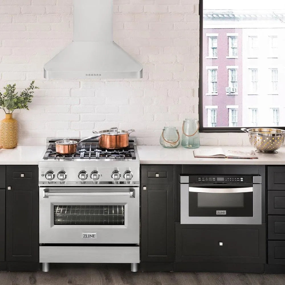 ZLINE Alpine Series Ducted Wall Mount Range Hood in Stainless Steel (ALP100WL) front, in a luxury rustic-style kitchen with matching appliances.