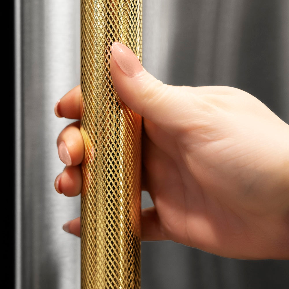 ZLINE Autograph Edition 24 in. Touchstone 151 Can Beverage Fridge with Solid Stainless Steel Door and Polished Gold Helix Handle (RBSOZ-ST-24-KG) hand holding Helix handle showing knurled diamond texture.
