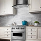 ZLINE Wall Mount Range Hood in Stainless Steel (KN6) in a luxury cottage-style kitchen front.