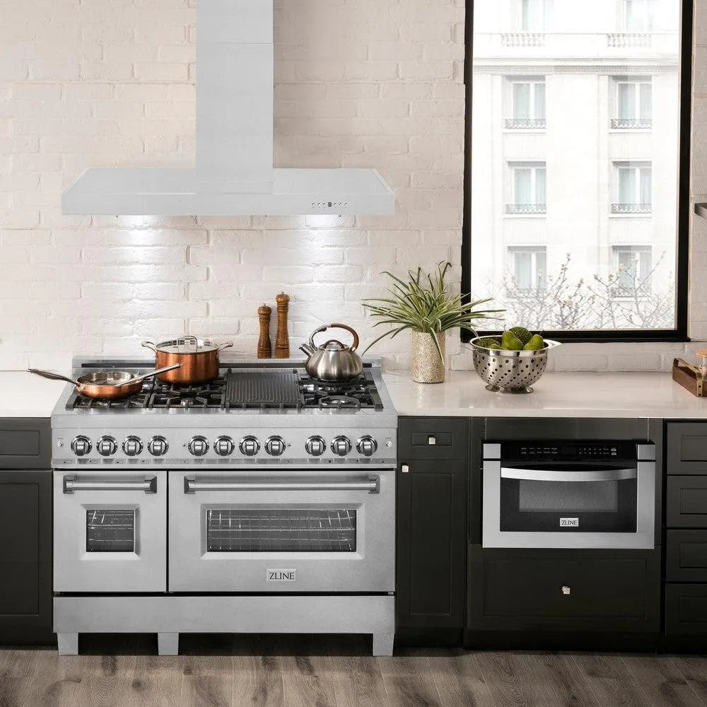 ZLINE Convertible Vent Wall Mount Range Hood in Stainless Steel (KE) above a large range in modern kitchen