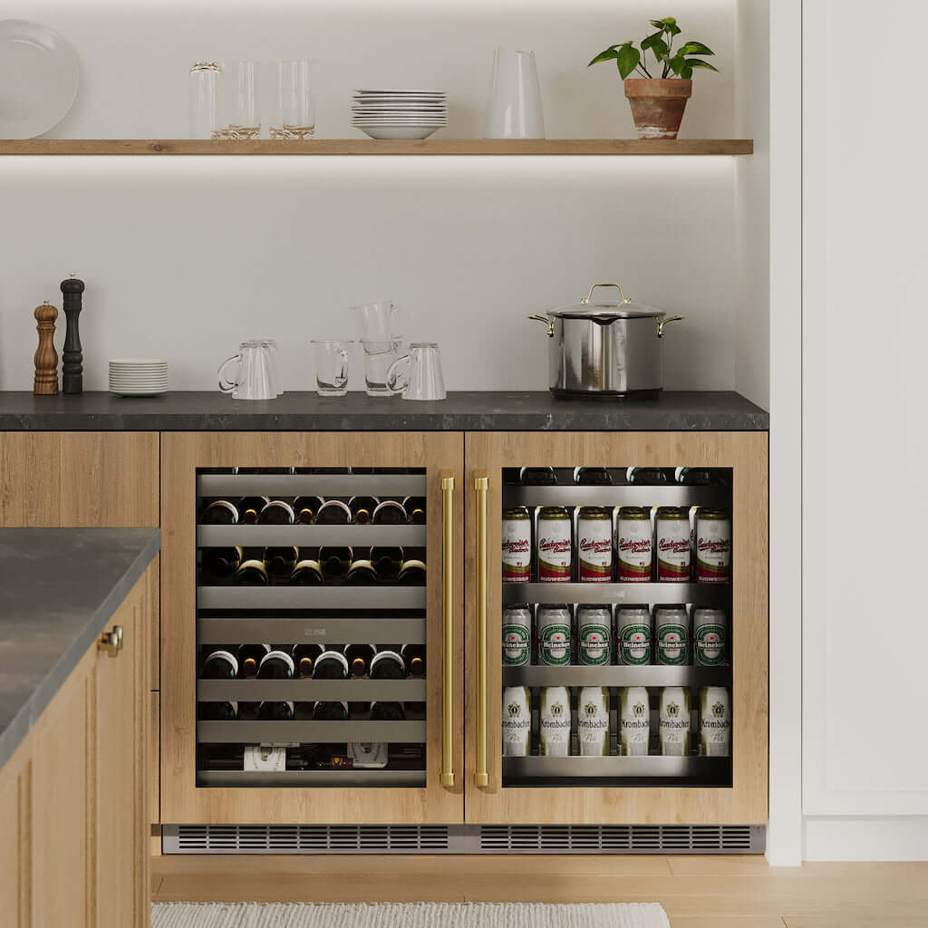 ZLINE Touchstone Under Counter Dual Zone Wine Cooler and Beverage Fridge side-by-side under dark countertop with wooden cabinetry in a luxury kitchen.