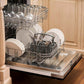 ZLINE 24 in. Black Matte Top Control Built-In Dishwasher with Stainless Steel Tub and Modern Style Handle, 52dBa (DW-BLM-H-24) open, with dishes loaded in a rustic-themed kitchen from side.