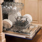 ZLINE 24 in. Blue Matte Top Control Built-In Dishwasher with Stainless Steel Tub and Modern Style Handle, 52dBa (DW-BM-H-24) open, with dishes loaded in a rustic-themed kitchen from side.