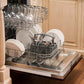 ZLINE 24 in. Oil-Rubbed Bronze Top Control Built-In Dishwasher with Stainless Steel Tub and Traditional Style Handle, 52dBa (DW-ORB-H-24) open, with dishes loaded in a rustic-themed kitchen from side.