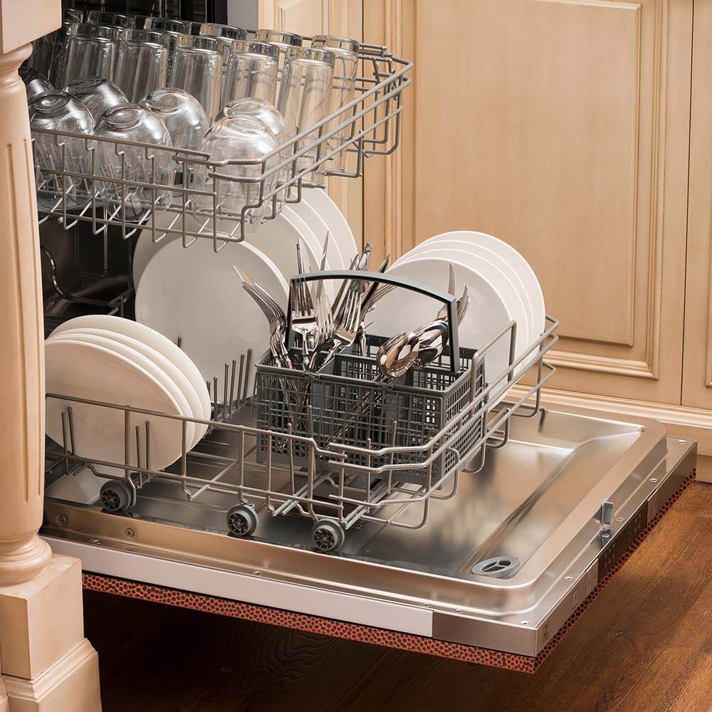 ZLINE 24 in. Hand-Hammered Copper Top Control Built-In Dishwasher with Stainless Steel Tub and Modern Style Handle, 52dBa (DW-HH-24) open, with dishes loaded in a rustic-themed kitchen from side.