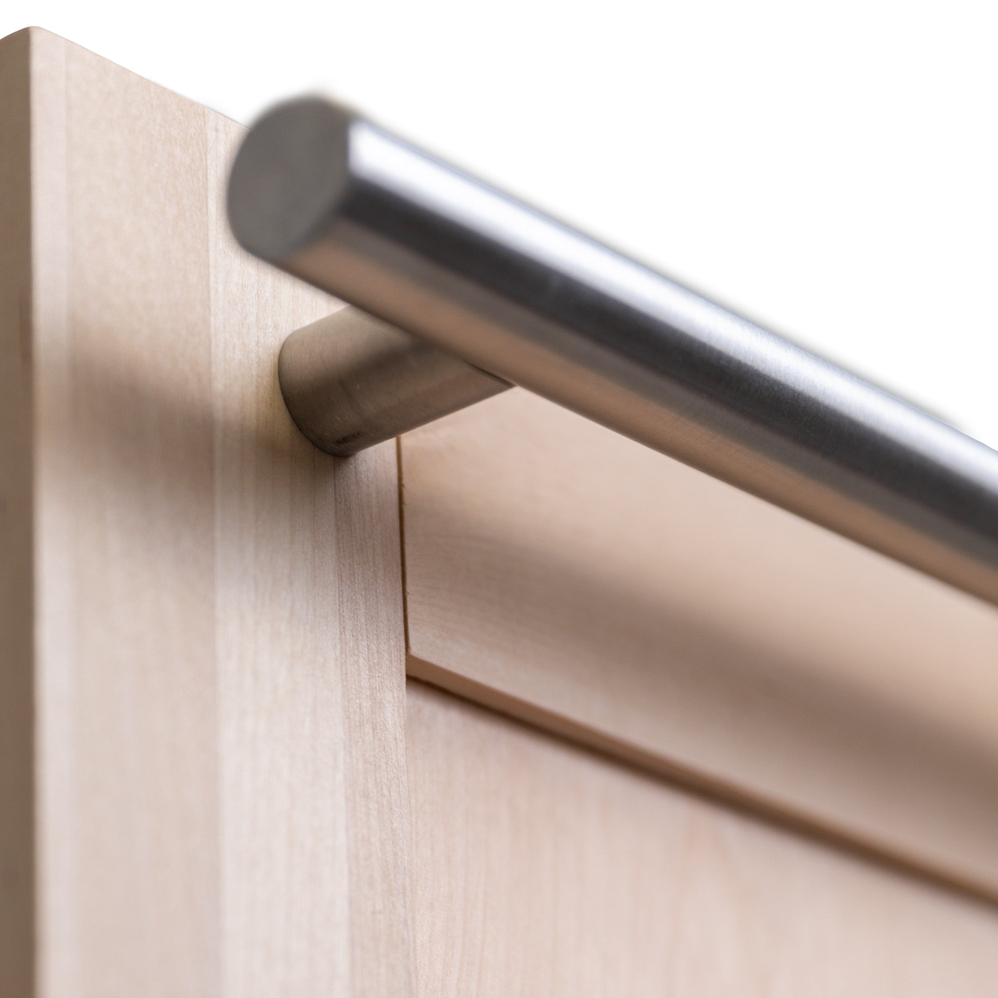 Modern handle and unfinished wood panel close up left under.