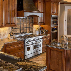 Rustic kitchen with custom hood using ZLINE 46 in. Ducted Wall Mount Range Hood Insert in Stainless Steel (698-46) and stainless steel appliances and wooden cabinets