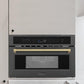 ZLINE Autograph Edition 30 in. 1.6 cu ft. Built-in Convection Microwave Oven in Black Stainless Steel with Champagne Bronze Accents (MWOZ-30-BS-CB) built-in to beige cabinets