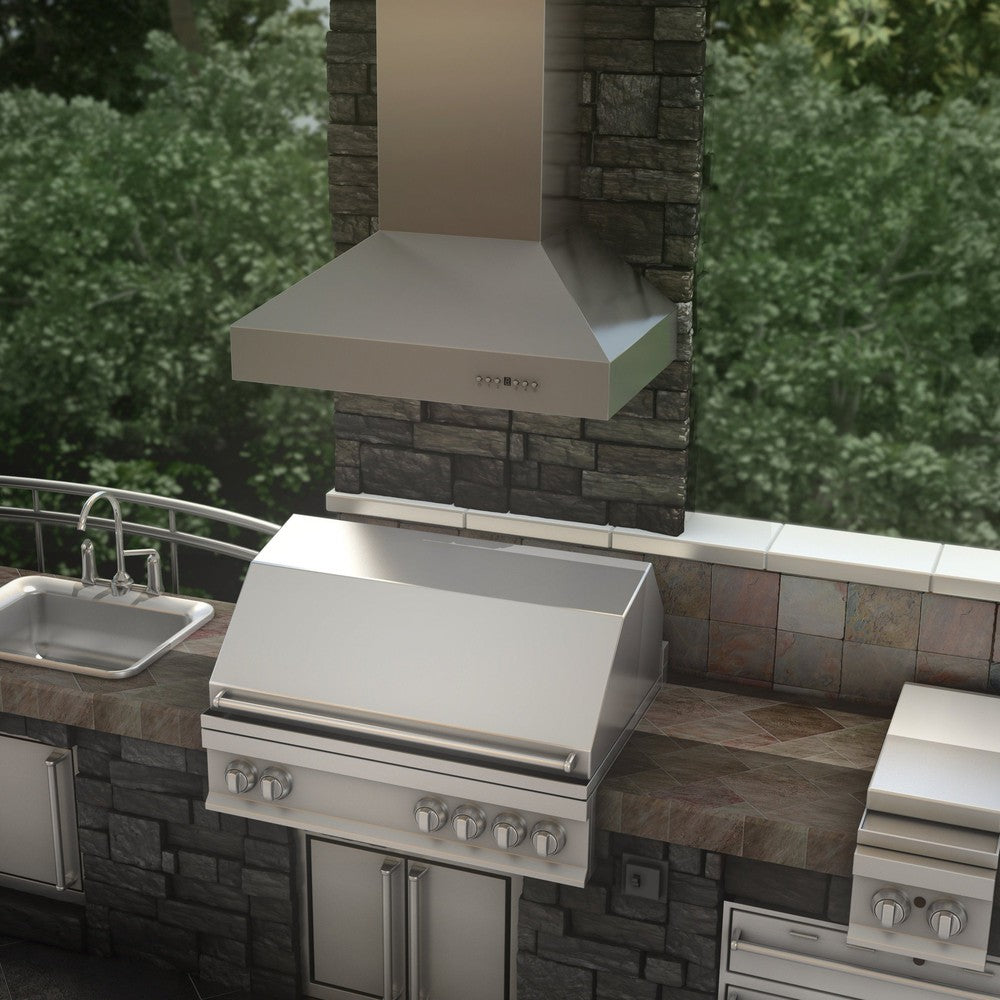 ZLINE Ducted Wall Mount Range Hood in Outdoor Approved Stainless Steel (697-304) rendering above barbecue in outdoor kitchen from above.